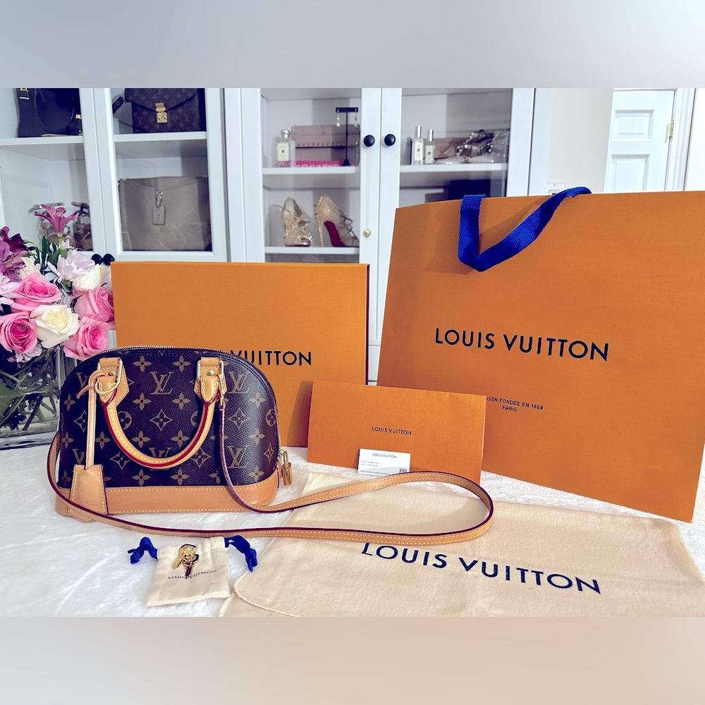 Authentic Louis Vuitton Alma BB handbag in classic iconic Monogram canvas